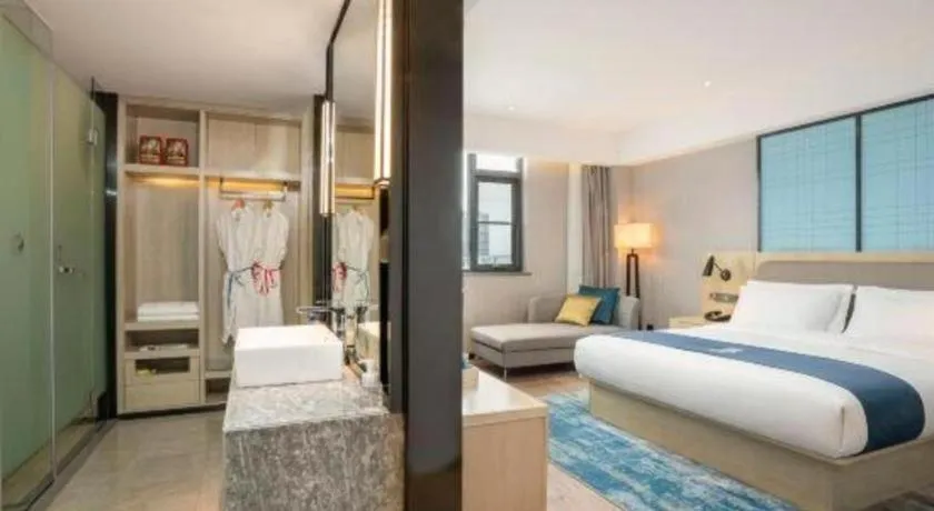 Bed in Echarm Hotel Jianshui Gucheng