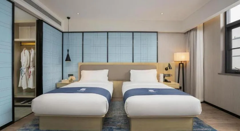 Bed in Echarm Hotel Jianshui Gucheng