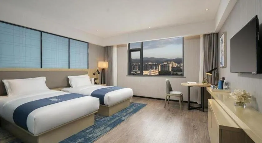 Bed in Echarm Hotel Jianshui Gucheng