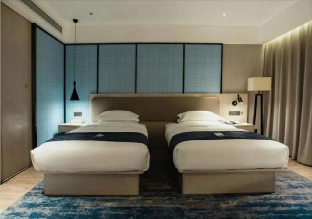 Bed in Echarm Hotel Jianshui Gucheng