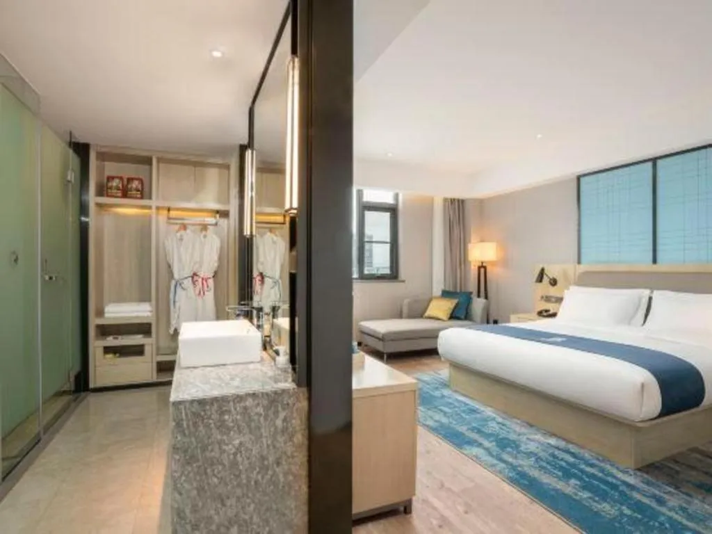 Bed in Echarm Hotel Jianshui Gucheng