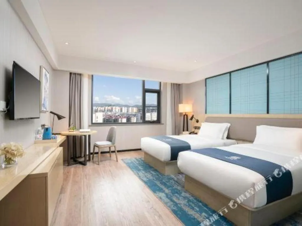 Bed in Echarm Hotel Jianshui Gucheng