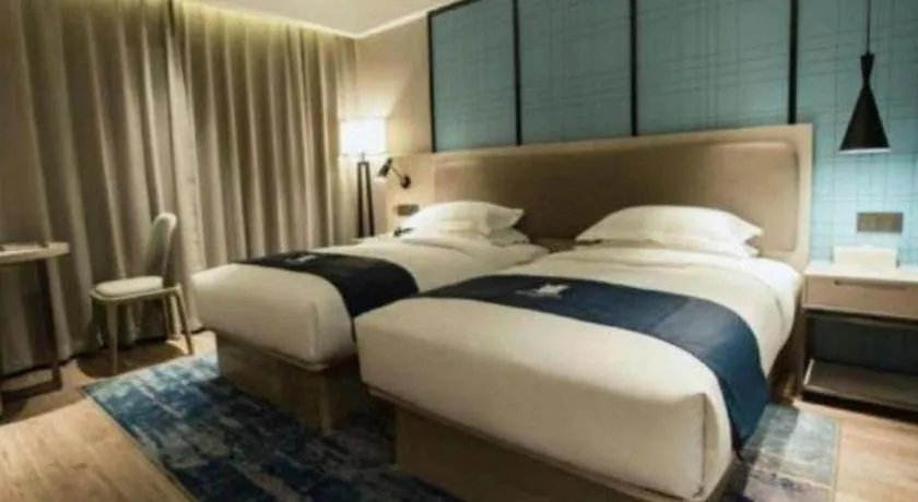 Bed in Echarm Hotel Jianshui Gucheng