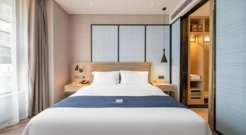 Bed in Echarm Hotel Binzhou Boxing Yinzuo