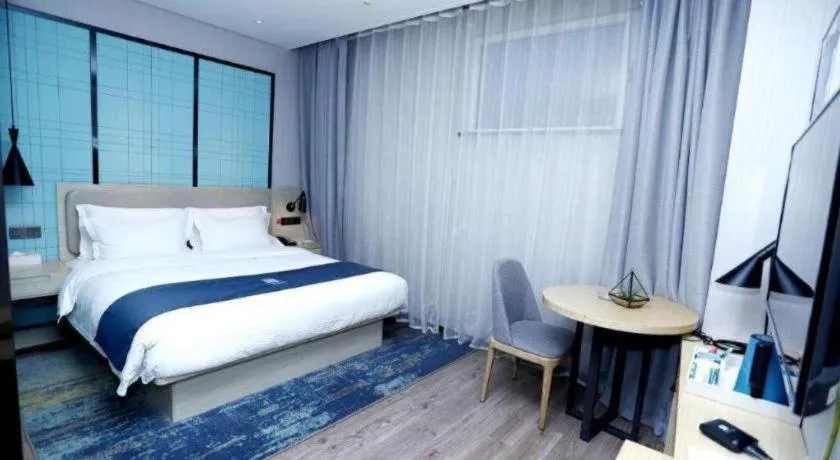 Bed in Echarm Hotel Binzhou Boxing Yinzuo