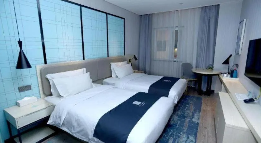 Bed in Echarm Hotel Binzhou Boxing Yinzuo