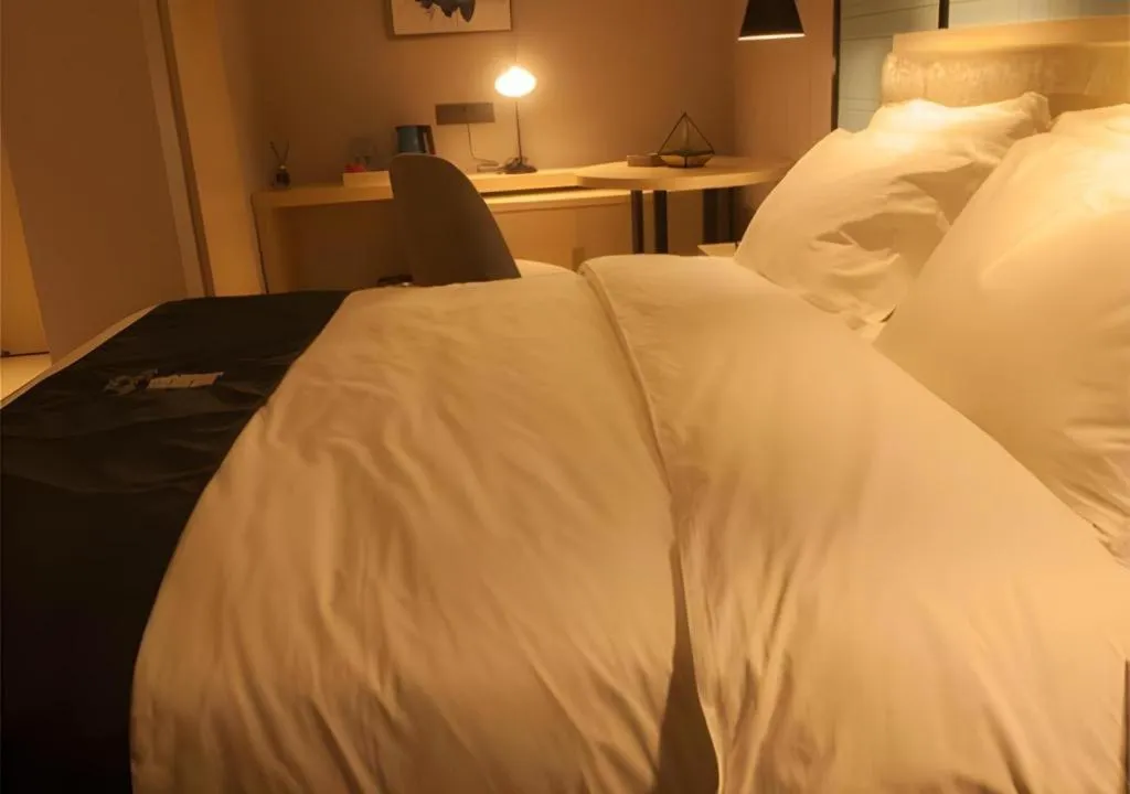 Bed in Echarm Hotel Binzhou Boxing Yinzuo