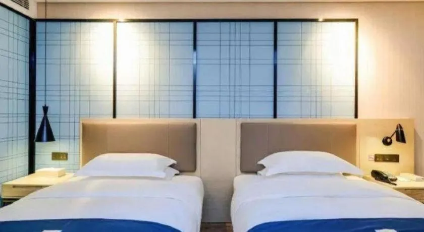 Bed in Echarm Hotel Binzhou Boxing Yinzuo