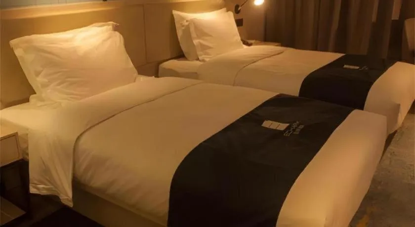 Bed in Echarm Hotel Binzhou Boxing Yinzuo