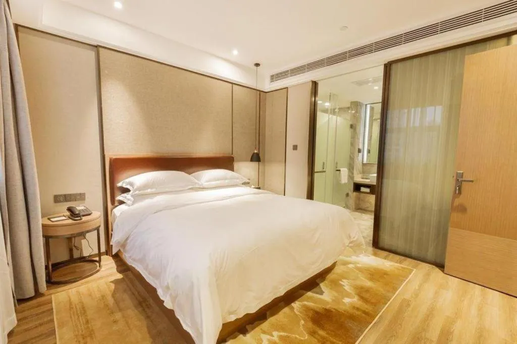 Bed in Borrman Hotel Liuzhou Guizhong Avenue Liugao