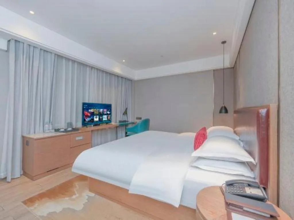 Bed in Borrman Hotel Liuzhou Guizhong Avenue Liugao