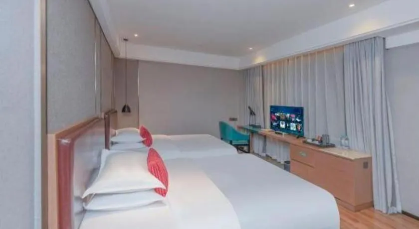 Bed in Borrman Hotel Liuzhou Guizhong Avenue Liugao
