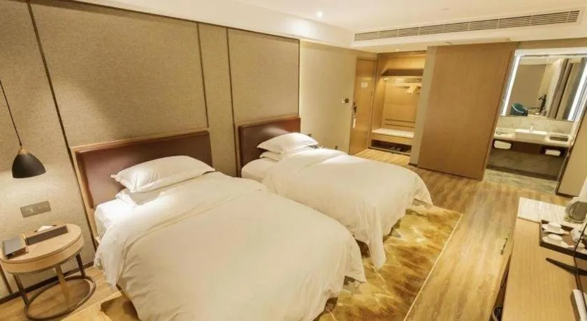 Bed in Borrman Hotel Liuzhou Guizhong Avenue Liugao