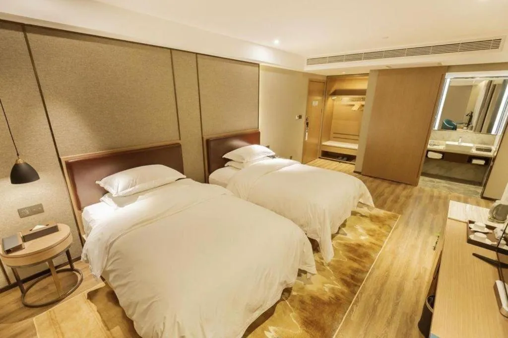 Bed in Borrman Hotel Liuzhou Guizhong Avenue Liugao