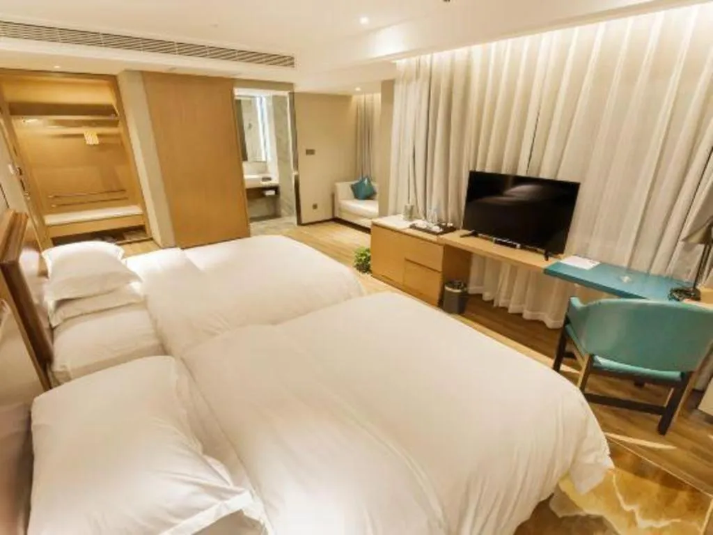 Bed in Borrman Hotel Liuzhou Guizhong Avenue Liugao