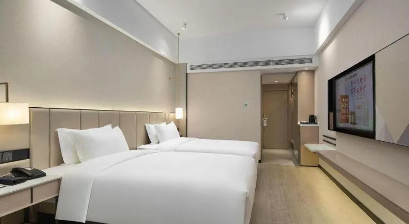 Bed in Borrman Hotel Liuzhou Guizhong Avenue Liugao