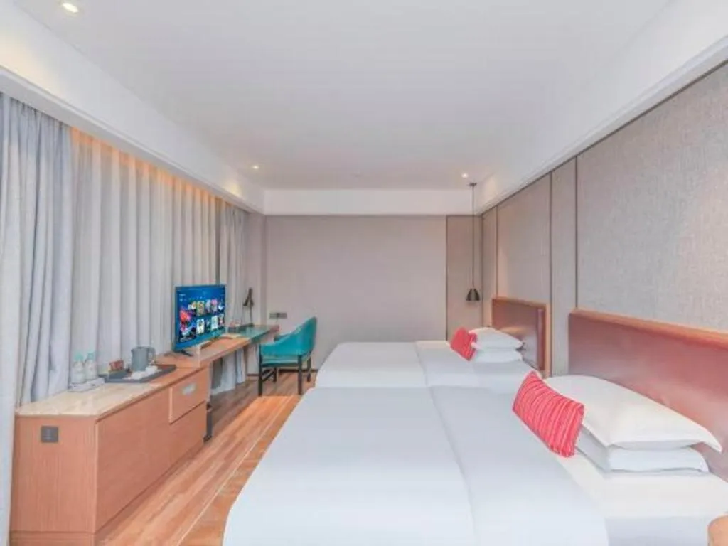 Bed in Borrman Hotel Liuzhou Guizhong Avenue Liugao