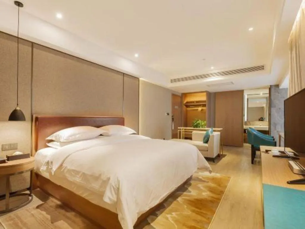 Bed in Borrman Hotel Liuzhou Guizhong Avenue Liugao