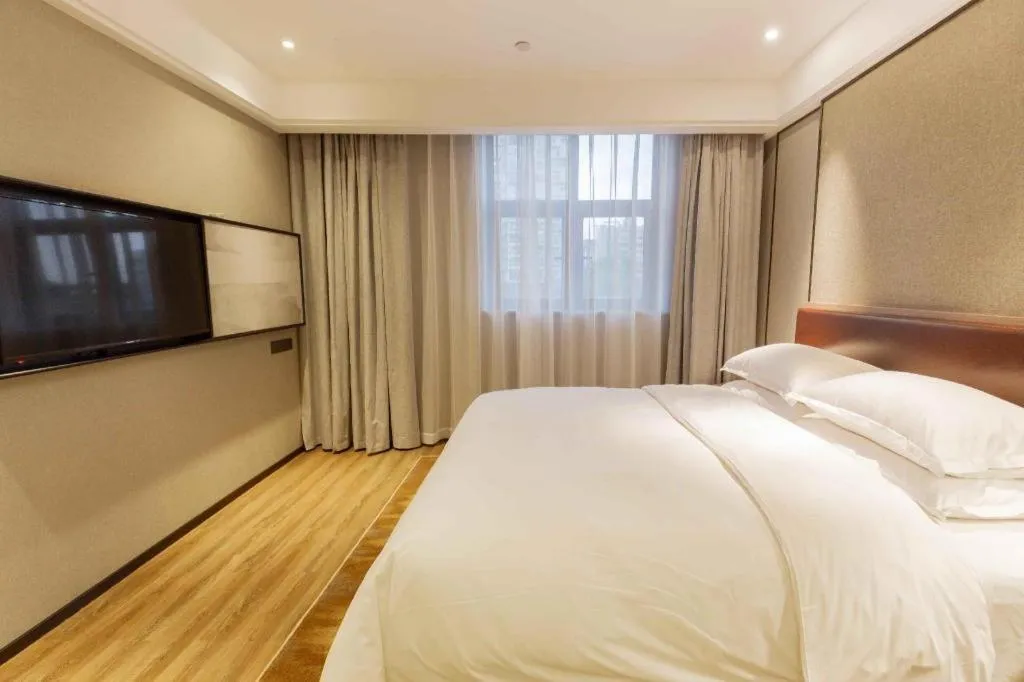 Bed in Borrman Hotel Liuzhou Guizhong Avenue Liugao