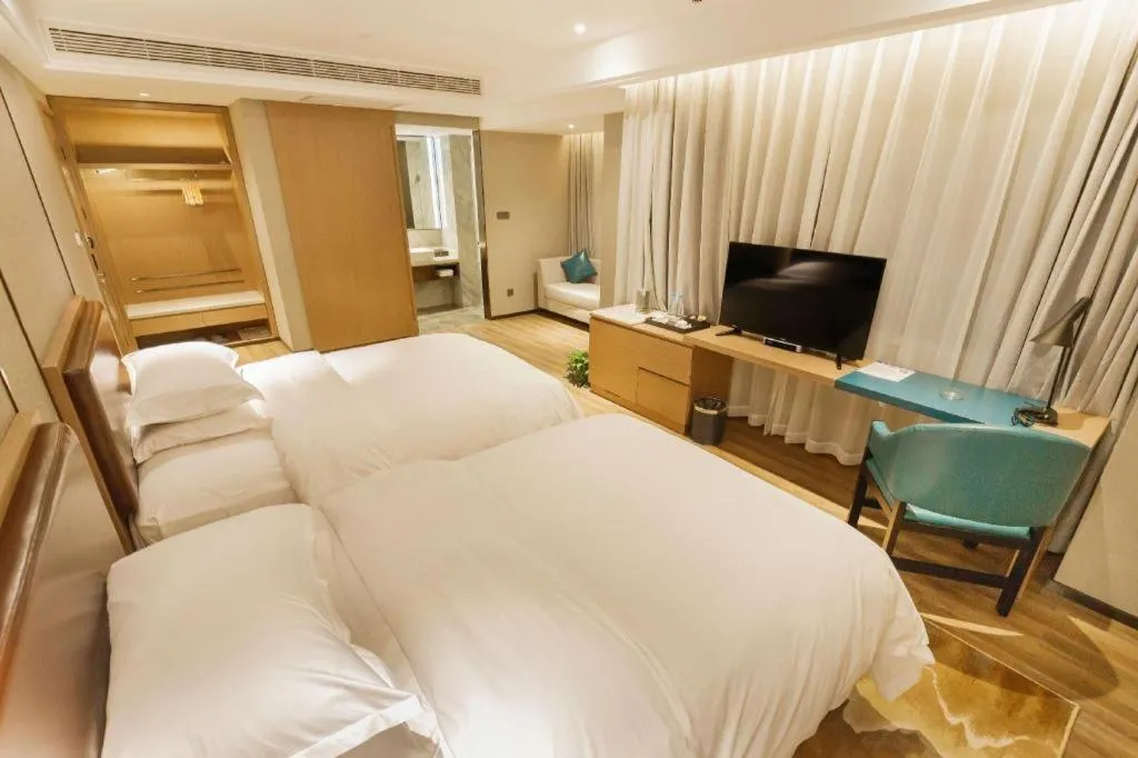 Bed in Borrman Hotel Liuzhou Guizhong Avenue Liugao