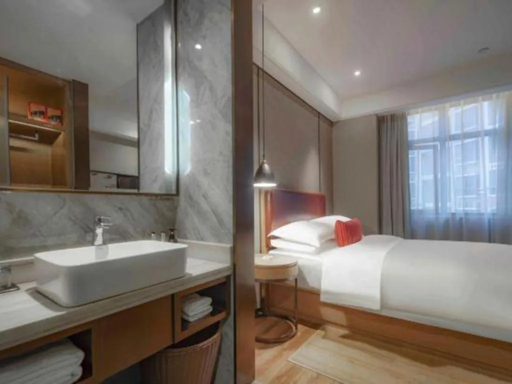 Bed in Borrman Hotel Liuzhou Guizhong Avenue Liugao