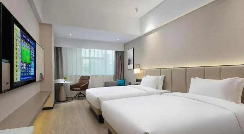 Bed in Borrman Hotel Liuzhou Guizhong Avenue Liugao