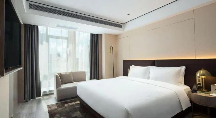 Bed in Echarm Plus Hotel Changsha High-speed Railway South Station Desiqin