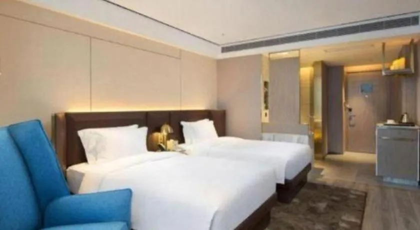 Bed in Echarm Plus Hotel Changsha High-speed Railway South Station Desiqin