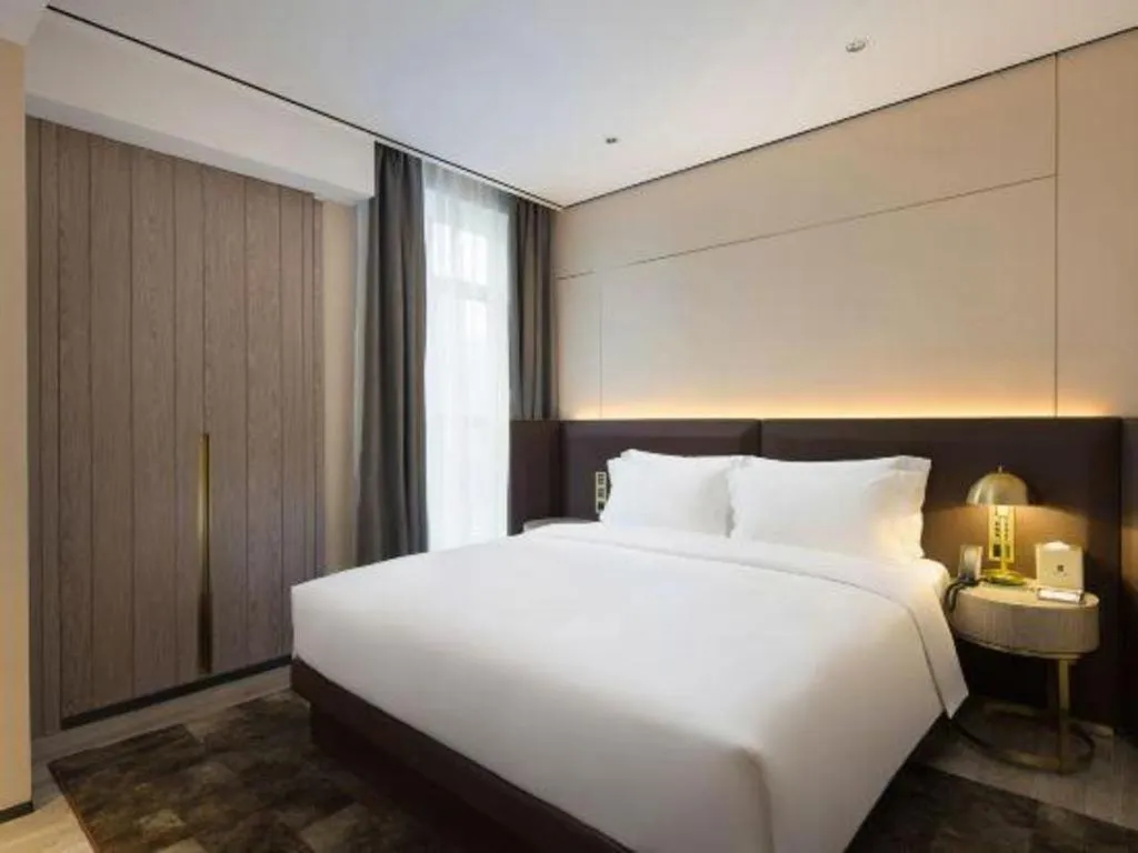Bed in Echarm Plus Hotel Changsha High-speed Railway South Station Desiqin