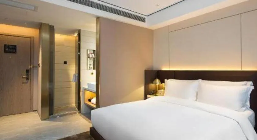 Bed in Echarm Plus Hotel Changsha High-speed Railway South Station Desiqin