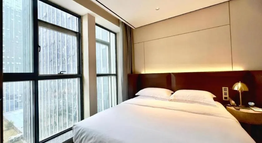 Bed in Echarm Plus Hotel Changsha High-speed Railway South Station Desiqin