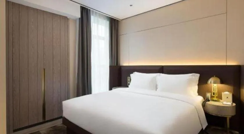 Bed in Echarm Plus Hotel Changsha High-speed Railway South Station Desiqin