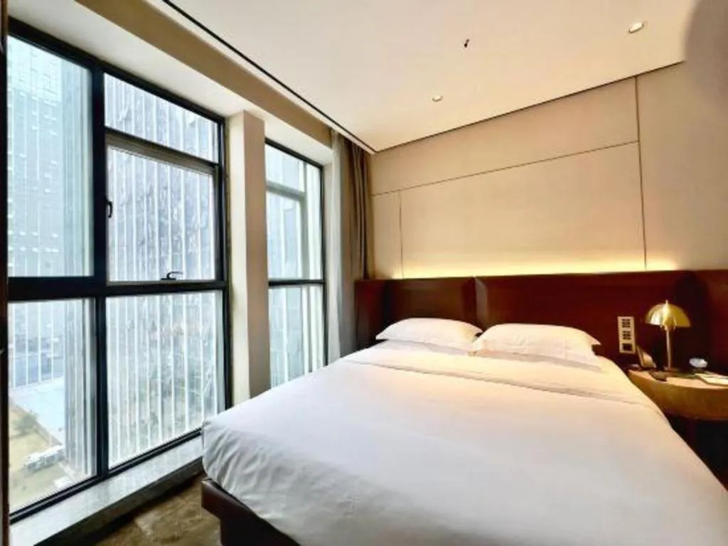 Bed in Echarm Plus Hotel Changsha High-speed Railway South Station Desiqin