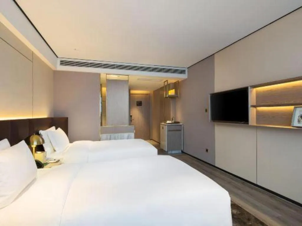 Bed in Echarm Plus Hotel Changsha High-speed Railway South Station Desiqin