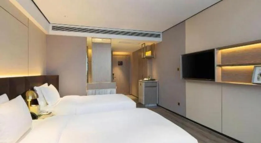 Bed in Echarm Plus Hotel Changsha High-speed Railway South Station Desiqin