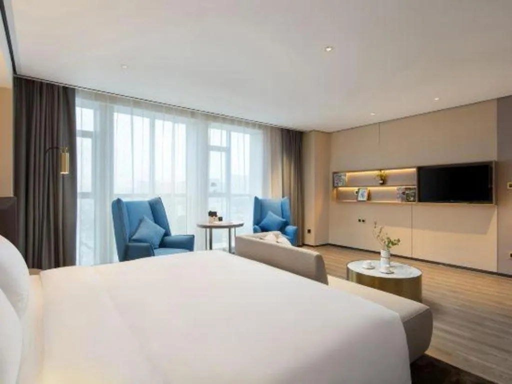Bed in Echarm Plus Hotel Changsha High-speed Railway South Station Desiqin