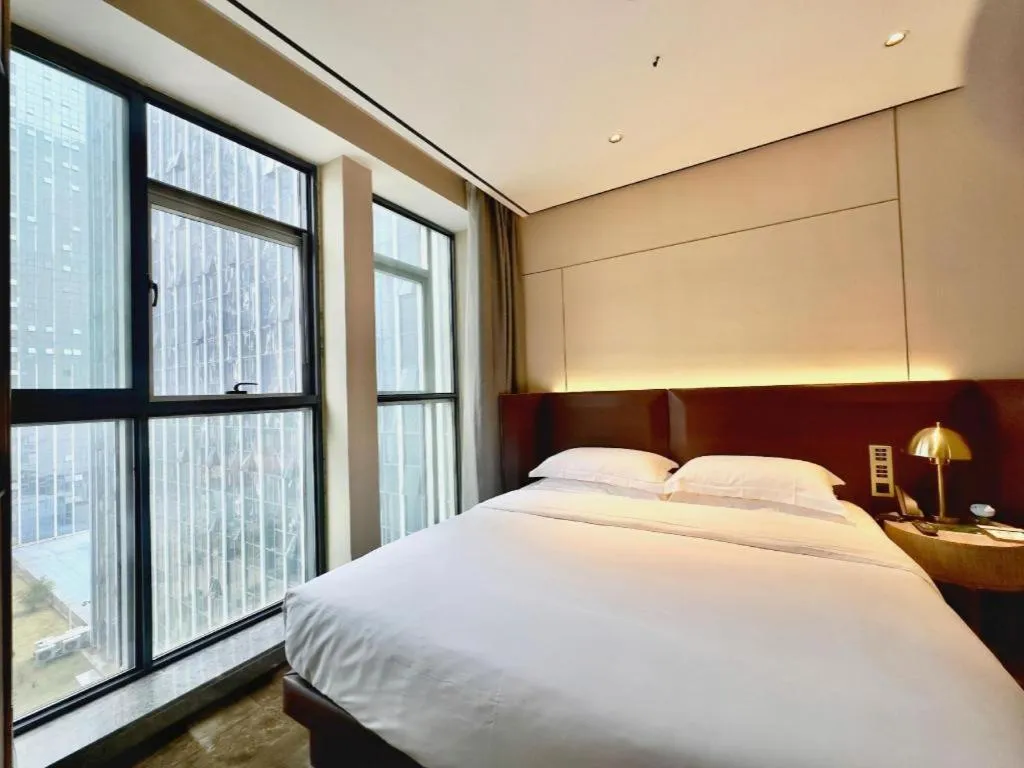 Bed in Echarm Plus Hotel Changsha High-speed Railway South Station Desiqin