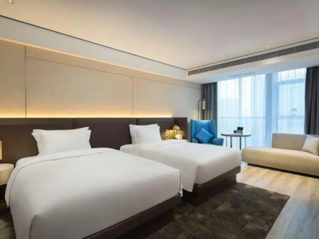 Bed in Echarm Plus Hotel Changsha High-speed Railway South Station Desiqin