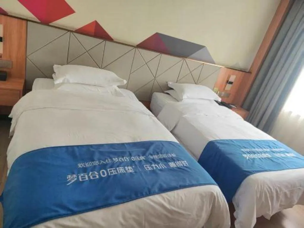 Bed in Borrman Hotel Jingzhou Jiangjin West Road Wanda Plaza Fantawild