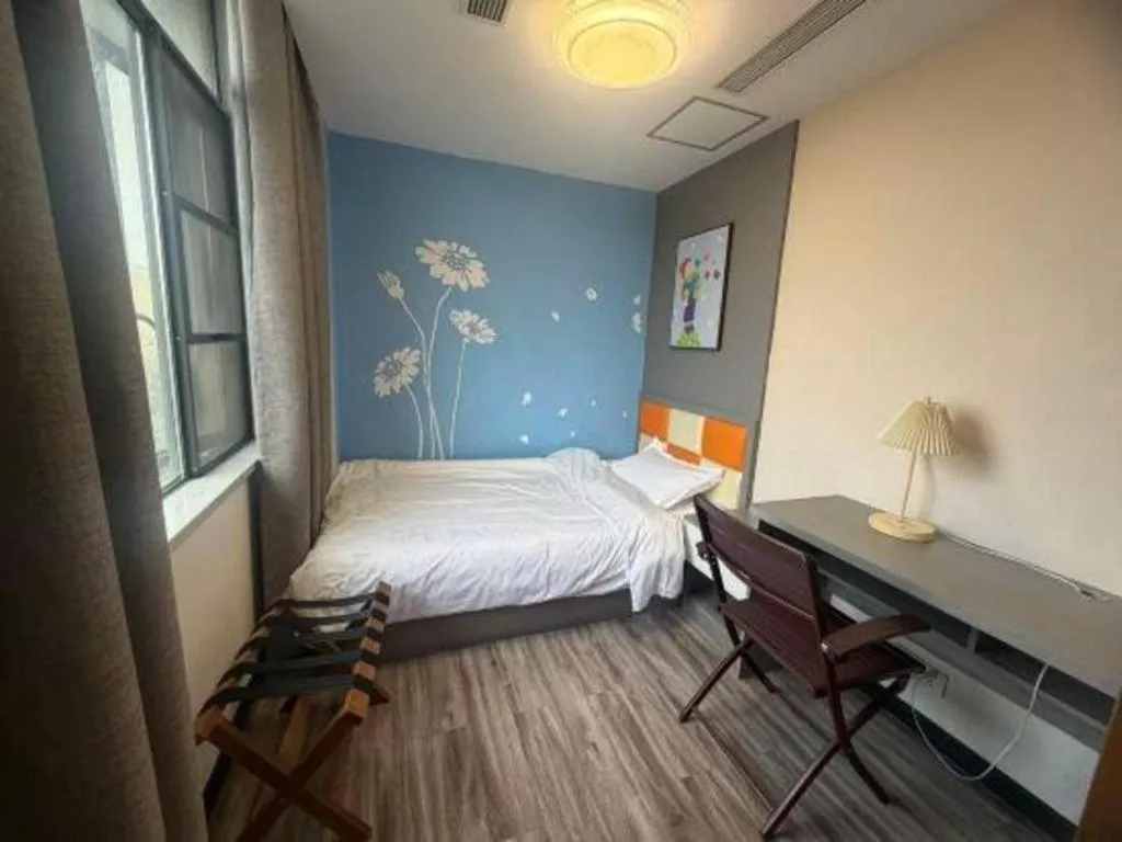 Bed in Borrman Hotel Jingzhou Jiangjin West Road Wanda Plaza Fantawild