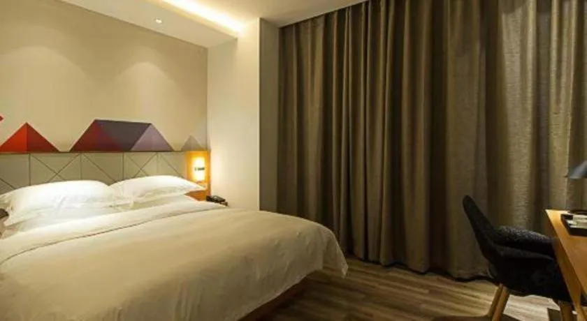 Bed in Borrman Hotel Jingzhou Jiangjin West Road Wanda Plaza Fantawild
