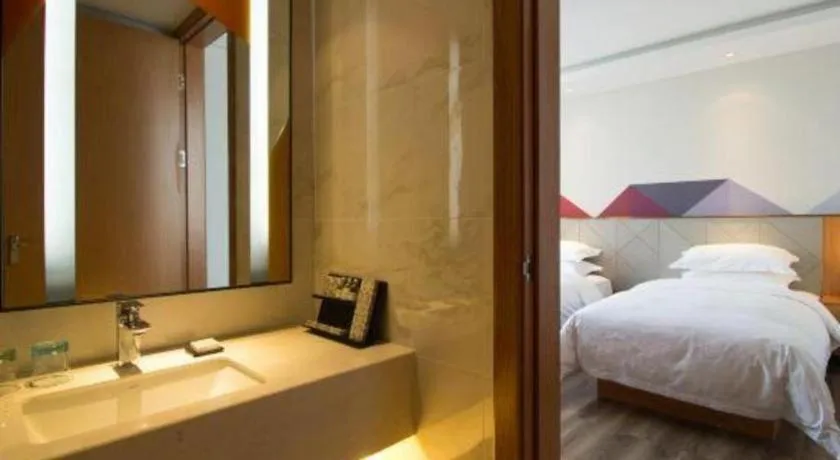 Bed in Borrman Hotel Jingzhou Jiangjin West Road Wanda Plaza Fantawild