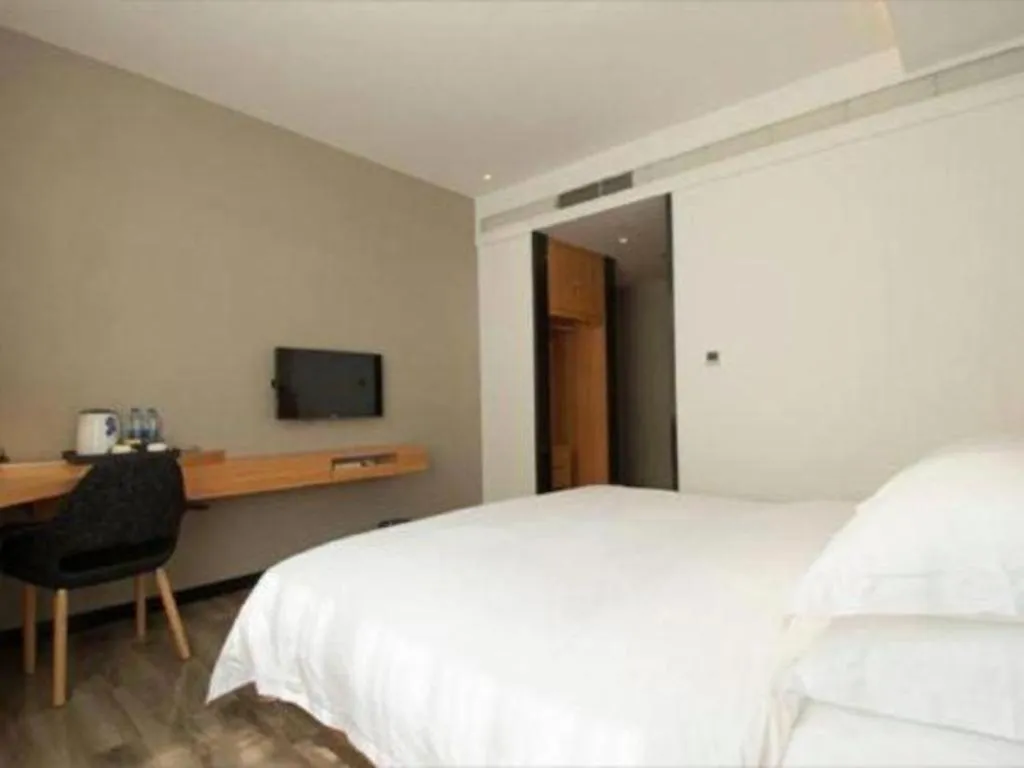 Bed in Borrman Hotel Jingzhou Jiangjin West Road Wanda Plaza Fantawild