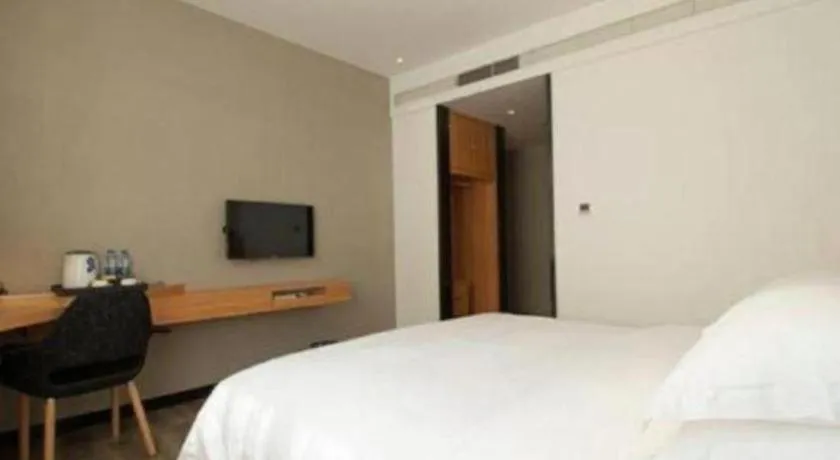 Bed in Borrman Hotel Jingzhou Jiangjin West Road Wanda Plaza Fantawild