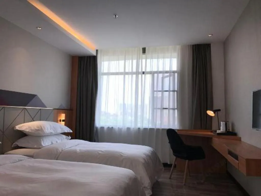 Bed in Borrman Hotel Jingzhou Jiangjin West Road Wanda Plaza Fantawild