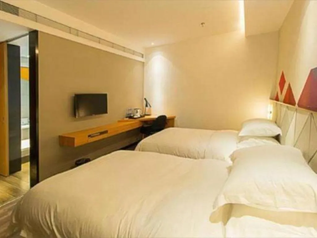 Bed in Borrman Hotel Jingzhou Jiangjin West Road Wanda Plaza Fantawild