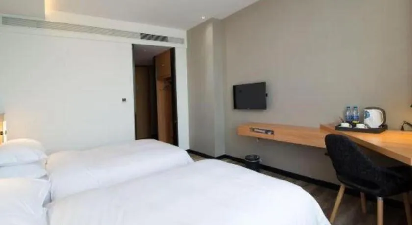 Bed in Borrman Hotel Jingzhou Jiangjin West Road Wanda Plaza Fantawild