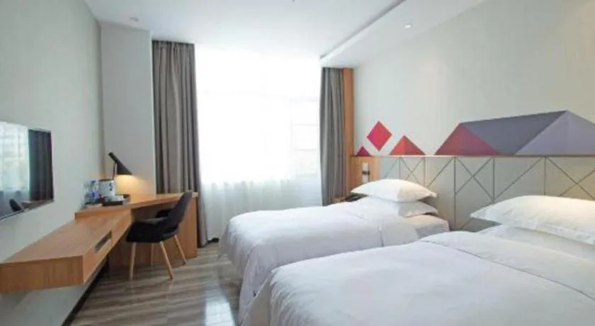 Bed in Borrman Hotel Jingzhou Jiangjin West Road Wanda Plaza Fantawild