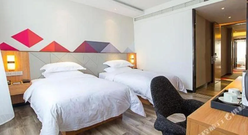 Bed in Borrman Hotel Jingzhou Jiangjin West Road Wanda Plaza Fantawild