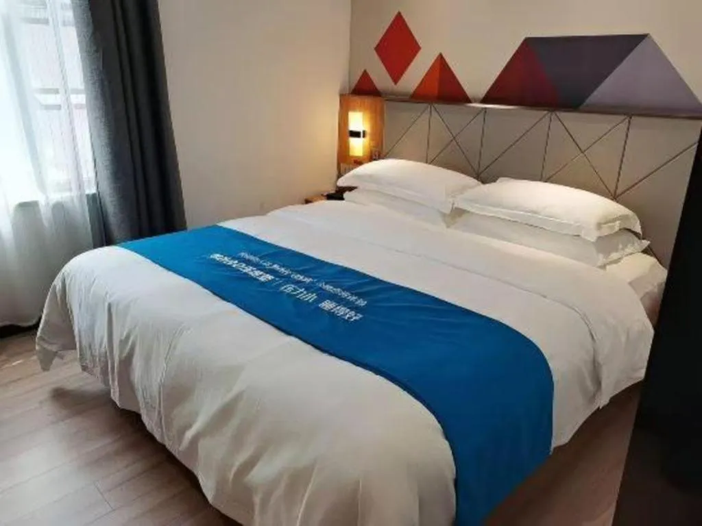 Bed in Borrman Hotel Jingzhou Jiangjin West Road Wanda Plaza Fantawild